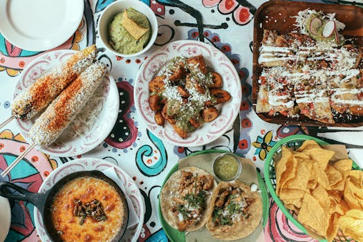 Vibrant Mexican meal featuring tacos, elote, nachos, and more. Perfect for food lovers.