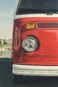 Close-up of a classic red Volkswagen van front view in Sharjah, UAE.