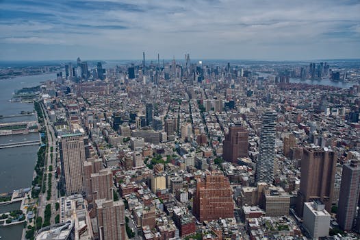 Breathtaking aerial view of the Manhattan skyline with the Hudson River, showcasing New York City's dense architecture.